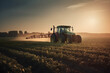 Tractor spraying soybean field in sunset