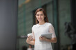 © Image Smith - Asian business woman using a digital tablet.