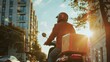 A delivery person rides a motorbike on a city street at sunset, carrying a red insulated box, embodying efficient urban delivery