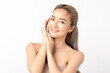 © Shutter B - Happy beautiful young asian woman smile touching her face on white background, clean fresh bare skin concept. Facial treatment, Perfect skin, Natural make up.