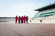 © Connect Images - Racing team poised on the track for action. Pit crew in action during a tire change at a race track.