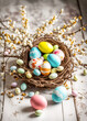 Decorated colorful Easter eggs and catkins spring arrangement on old table