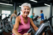 middle aged woman doing a spinning class at a gym. aged woman working out exercising on a treadmill in a gym. mood fun
