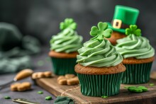 Three Cupcakes With Green Frosting And A Leprechaun Hat For St. Patricks Day