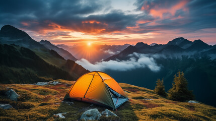 camping tent high in the mountains. tourist tent camping in mountains at sunset