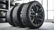 Car tires with a great profile in the car repair shop. Set of summer or winter tyres in front of white fond.