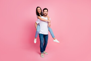 Poster - Full size photo of attractive young couple piggyback dating have fun wear trendy white outfit isolated on pink color background