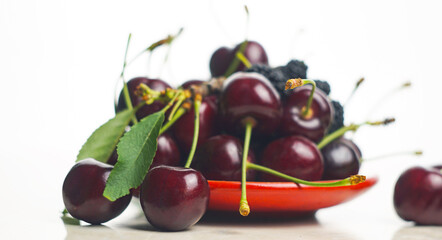 Wall Mural - There are red cherries on a white background