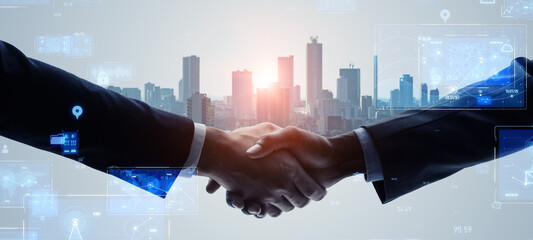 Mixed media of group of people shaking hands and digital technology concept. Business technology. System engineering. Wide angle visual for banners or advertisements.