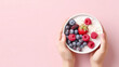 Hand hold bowl of yogurt with berry for healthy food , safety food, healthy lifestyle, Diet