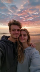 Wall Mural - Vertical portrait of boy and girl couple standing on a beach