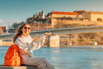 Sticker - Student or traveller girl exploring Petrovaradin fortress at Novi Sad city in Serbia