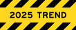 Yellow and black color with line striped label banner with word 2025 trend