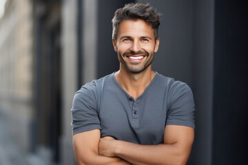 Poster - Handsome smiling young man with . Smiling,crossed hands 