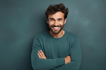 Poster - Handsome smiling young man with . Smiling,crossed hands 
