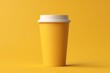 a yellow cup with a white lid