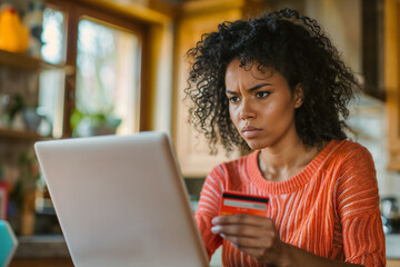 Frustrated woman sitting on laptop