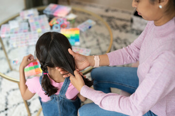 Wall Mural - Mother doing daughter braids