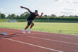 © Cultura Creative - Athlete sprinting at running track