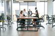 © standret - Giving the documents. Group of office workers are together indoors