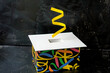 april fool's day abstract box with surprise and joke on black background, generative ai