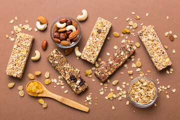 Poster - Various granola bars on table background. Cereal granola bars. Superfood breakfast bars with oats, nuts and berries, close up. Superfood concept
