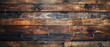 The image captures the rugged appeal of dark, weathered wooden planks with a rich, textural patina and rustic charm