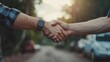 New car dealership: handshake symbolizing purchase agreement between seller and customer. Sales, financing, rental, insurance, installment options available