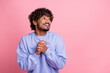 © deagreez - Photo of positive funny glad man wear stylish blue clothes hands together look up empty space isolated on pink color background