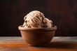 Tasty ice cream in a clay dish against a minimalist or empty room background