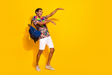 Wall Mural - Full length body photo of boogie woogie dancing guy in shorts t shirt and hawaii style necklace isolated on yellow color background