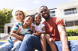 © Wavebreak Media - African American family with a father, mother, son, and daughter smiling outdoors