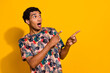 © deagreez - Photo of tv broadcaster student guy for his small media pointing fingers empty space breaking news isolated on yellow color background