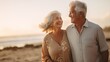 Capture the beauty of a couple of old mature people walking on the sand together, having fun on the beach, and truly enjoying and living in the moment. 