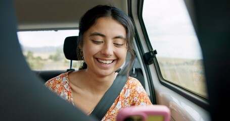 Wall Mural - Woman, phone and road trip in car with laugh, meme and comic video on internet on road for travel. Girl, smartphone and reading in vehicle with funny blog, social media post or story with transport