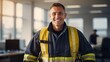 Smiling firefighter showing thumbs up in the office
