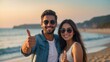 © Zahfran - Smiling couple showing thumbs up in the beach