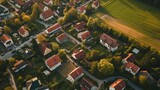 Fototapeta Miasto - Residential houses in small town near agricultural field, bird eye view