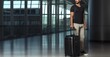 Young man with suitcase in the airport. Travel and tourism concept. Travel and business concept. Travel and tourism concept with copy space. Travel concept with copy space. 