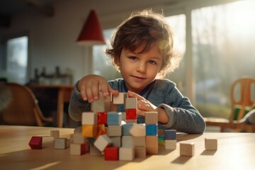 Poster - A young child playing with wooden blocks, suitable for educational concepts