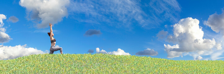 Wall Mural - Harmony with Nature: Woman Practicing Yoga in Lush Green Field Under Blue Sky