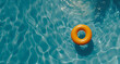 orange swimming pool ring float in blue pool water. Summer and vacation concept