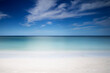 Symmetrical tropical white sand beach and calm sea background, calm
