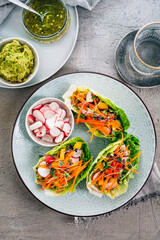 Poster - Vegan lettuce wraps with vegetables, avocado spread and microgreens