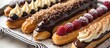 A platter is filled with a delectable assortment of homemade eclairs featuring vanilla, blueberry, and chocolate fillings.