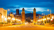 Cityscape of evening Placa d'Espanya with view of twin Venetian Towers.