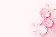 Elegant Pink Paper Flowers on Soft Pink Background for Spring and Summer Themes. Copy space