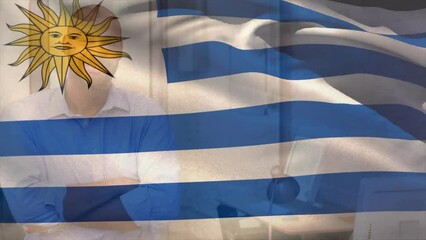 Poster - Animation of flag of uruguay over smiling biracial casual businessman in office