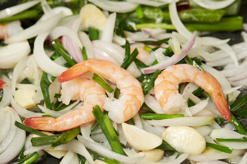 Wall Mural - Stir-fried vegetables and shrimp in a pan