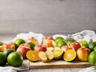 Wall Mural - Sliced apples, tangerines and fruits